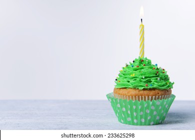 Delicious Birthday Cupcake On Table On White Background