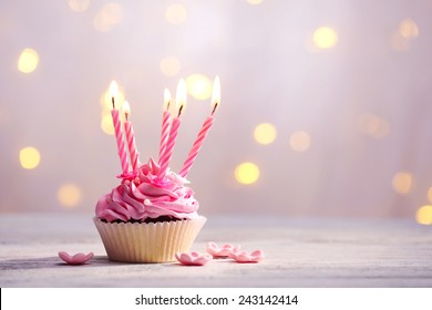 Delicious Birthday Cupcake On Table On Light Background