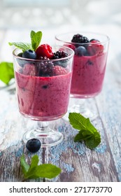 Delicious Blackberry,raspberry And Blueberry Smoothie Garnished With Fresh Berries In Glasses