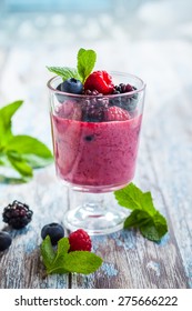 Delicious Blackberry,raspberry And Blueberry Smoothie Garnished With Fresh Berries In Glass