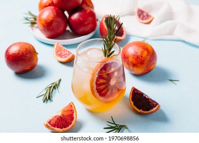 Delicious Blood Orange Cocktail On Light Blue Background. Summer Cocktails, Refreshing Drinks, Low Alcohol Mocktail Concept