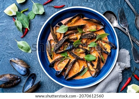 Delicious blue mussels in a spicy thai red curry sauce.