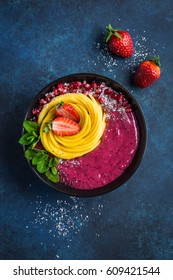 Delicious Blueberry And Mango Smoothie Bowl. Healthy Vegan Raw Food. Top View