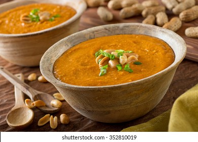 A delicious bowl of homemade african peanut soup with green onion garnish.