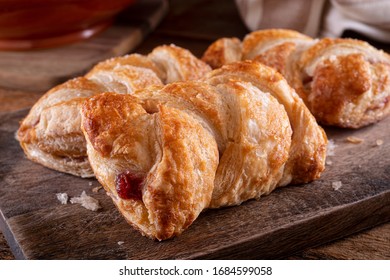 Delicious Braided Cherry Mini Strudels On A Rustic Wood Counter Top.