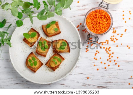 Similar – Image, Stock Photo Red organic lentils on a blackboard