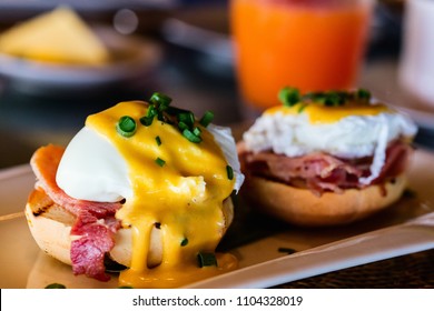 Delicious breakfast with eggs Benedict and juice