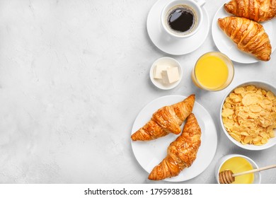 Delicious Breakfast With Fresh Croissants And Black Coffee On White Background. Top View. Copy Space.