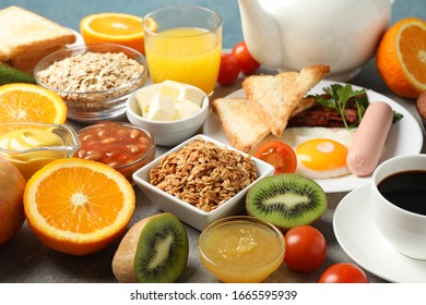 Delicious breakfast or lunch background. Grey table - Shutterstock ID 1665595939