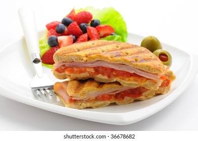 Delicious Breakfast Panini Served With Fresh Fruit.