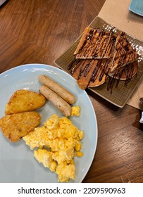 Delicious Breakfast Platter Eggs And Sausage, Waffles.