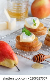 Delicious Bruschetta With Caramelized Pear, Camembert Or Brie Cheese, Honey And Mint. Fruit Dessert. Bread Toast, Crostini. Healthy Breakfast For Gourmets. Selective Focus, Copy Space