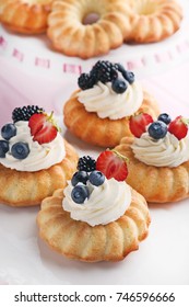 Delicious Bundt Cakes With Berries On White Plate