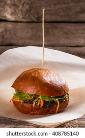 Delicious Burger On A Stick. Hamburger On Paper Wrapper. Fresh Ingredients Of High Quality. Small Order In Local Diner.