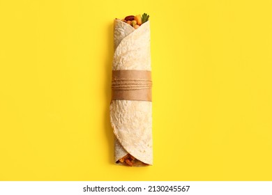 Delicious Burrito On Yellow Background