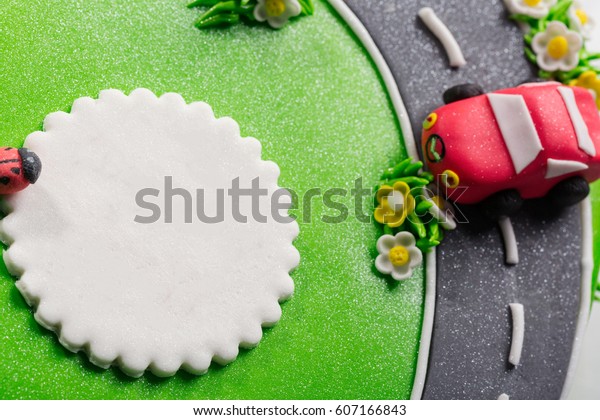 Delicious cake with ladybug and cars with free place\
for text close up.