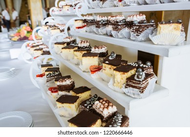 Delicious candy bar at the wedding reception. Chocolate cakes and muffins.Sweet red hearts. Desserts for guests. - Shutterstock ID 1220666446