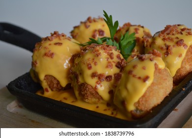 Delicious Cheese Balls With Cheddar Cheese Sauce 