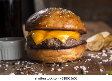 Delicious Cheese Burger On A Rustic Wooden Table