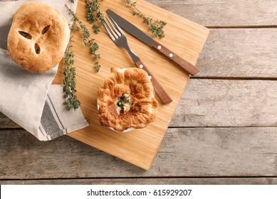 Delicious Chicken Pot Pie On Wooden Board