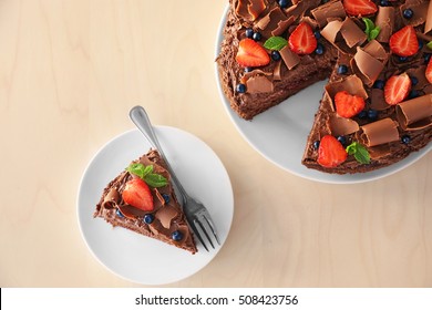 Delicious chocolate cake with strawberry on plate