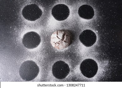 Delicious Chocolate Chip Cookies With Beautiful Cracks And Dusted With Icing Sugar On A Dark Background. View From Above. Only One Cookie Left On The Table