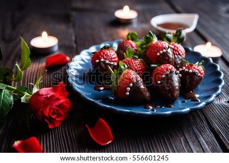 Delicious chocolate covered strawberries, decorated with silver sprinkles for Valentine's Day