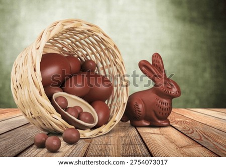 Delicious chocolate easter eggs and bunny on the desk