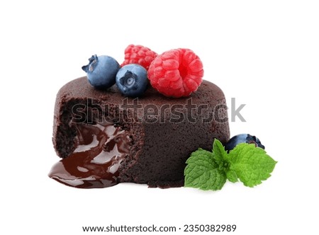 Delicious chocolate fondant, berries and mint isolated on white
