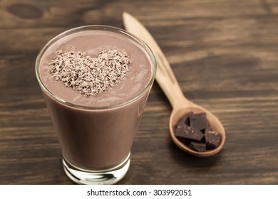 delicious chocolate shake with heart on wooden background. Cocktail, smoothies