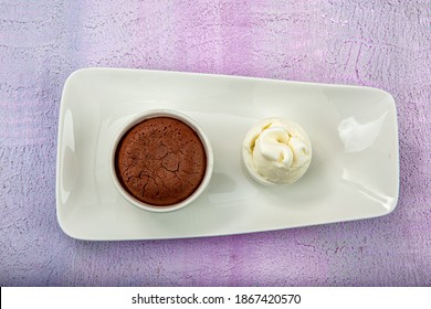 Delicious Chocolate Souffle With Ice Cream. Fluid Chocolate Souffle On White Plate.