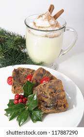 Delicious Christmas Fruitcake And Creamy Eggnog With Cinnamon And Nutmeg.