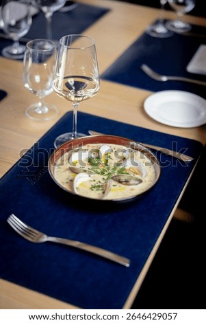 Delicious clam chowder and beverages at five star exclusive restaurant prepared by chef