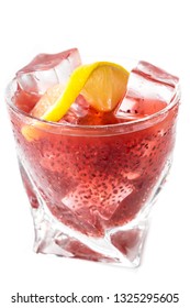 Delicious Cocktail Using Hydrated Chia Seeds And Tart Cherry Juice With Fresh Lemon Served On The Rocks Over A White Background