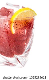 Delicious Cocktail Using Hydrated Chia Seeds And Tart Cherry Juice With Fresh Lemon Served On The Rocks Over A White Background