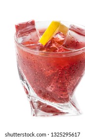 Delicious Cocktail Using Hydrated Chia Seeds And Tart Cherry Juice With Fresh Lemon Served On The Rocks Over A White Background