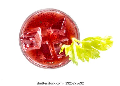 Delicious Cocktail Using Hydrated Chia Seeds And Tart Cherry Juice With Fresh Celery Served On The Rocks Over A White Background