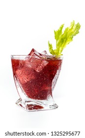 Delicious Cocktail Using Hydrated Chia Seeds And Tart Cherry Juice With Fresh Celery Served On The Rocks Over A White Background