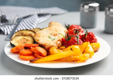 Delicious Cooked Chicken And Vegetables On Grey Table, Closeup. Healthy Meals From Air Fryer