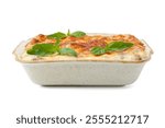 Delicious cooked lasagna in baking dish and basil isolated on white