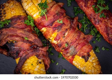 Delicious Corn On The Cob Wrapped In Bacon  Closeup