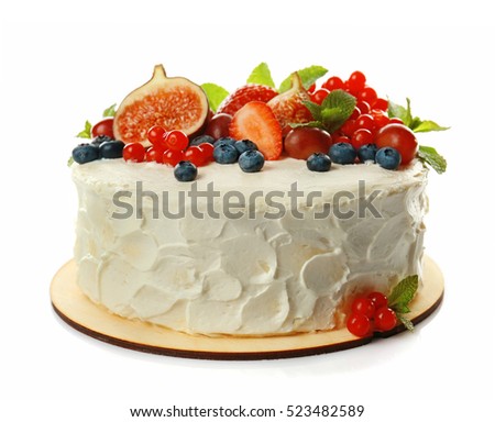 Delicious creamy cake with berries isolated on white