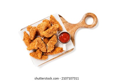Delicious crispy fried breaded chicken breast strips with ketchup. Isolated on white background. top view