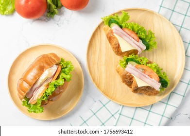 Delicious Croissants Sandwich With Fresh Ham, Cheese, Tomato, Cucumber, Lettuce And Sub Sandwich With Fresh Salad, Ham , Cheese On White Background. Top View With Copy Space. Flat Lay.