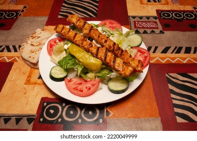 Delicious Cuisine Known As A Greek Salad With Chicken Kebab