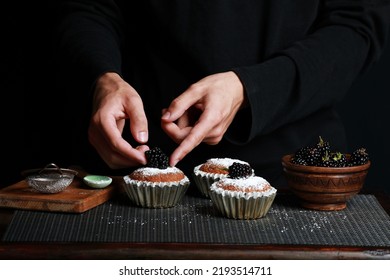 delicious cupcakes with blackberries and powdered sugar - Powered by Shutterstock