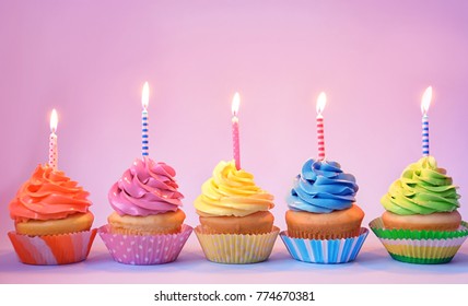 Delicious Cupcakes Candles On Color Background Stock Photo 774670381 ...