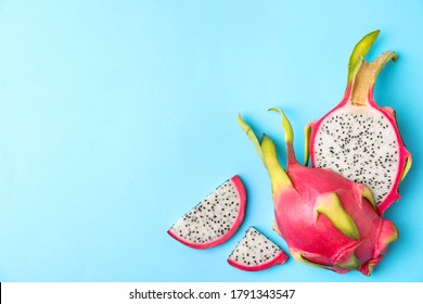 Delicious Cut Dragon Fruit (pitahaya) On Light Blue Background, Flat Lay. Space For Text