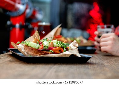 Delicious Dinner In Restaurant On A Wooden Table, No People Are Visible. Tasty Food With Beer In Cafe Or Pub Menu.