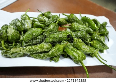 delicious dish of padron peppers